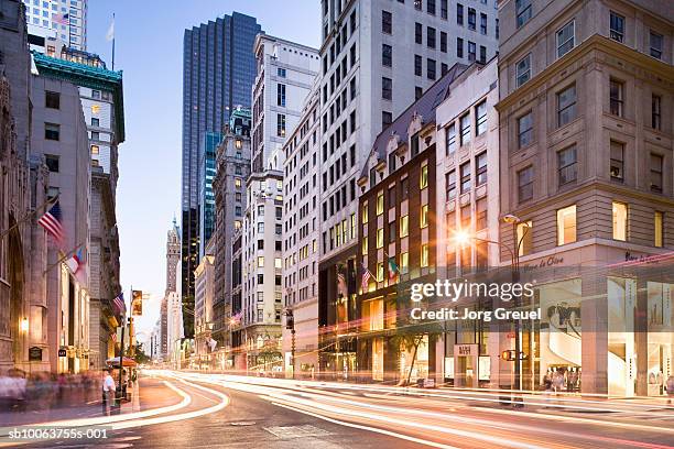 illuminated building and street at fifth avenue - fifth avenue stock pictures, royalty-free photos & images