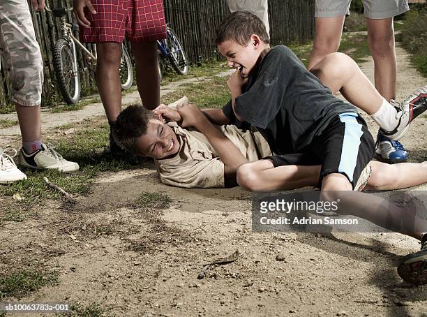 two boys (10-14) fighting - kids fighting stock pictures, royalty-free photos & images