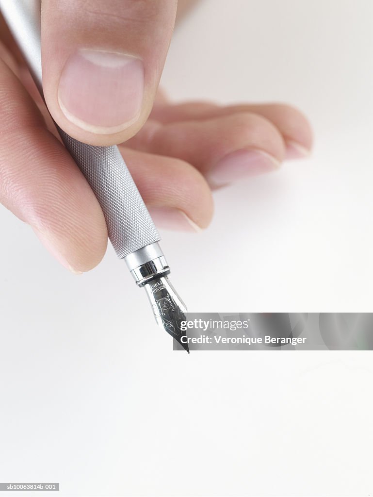 Man Holding Pen Closeup High-Res Stock Photo - Getty Images