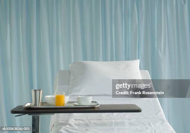 hospital bed with breakfast served - hospital food tray stock pictures, royalty-free photos & images