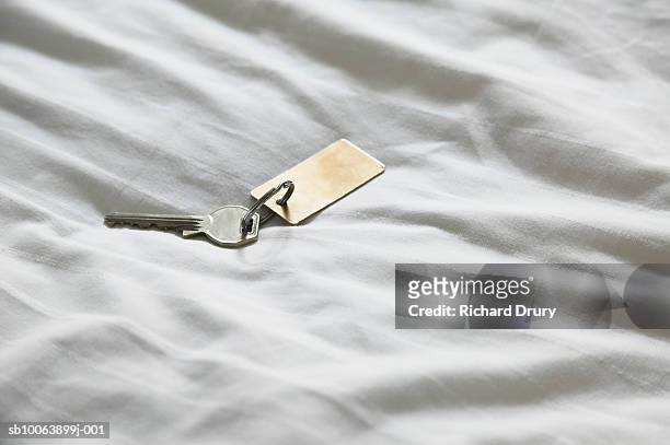 hotel key on bed - richard keys stock pictures, royalty-free photos & images