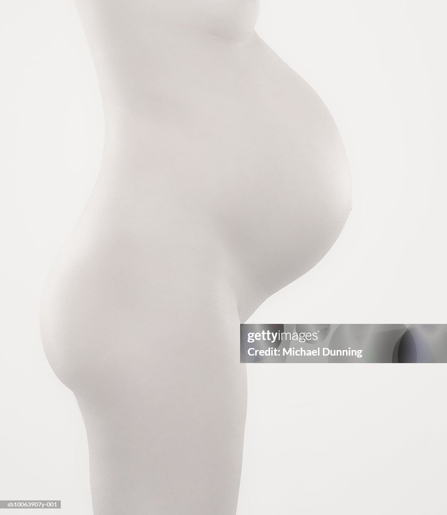 Pregnant woman, mid-section, side view