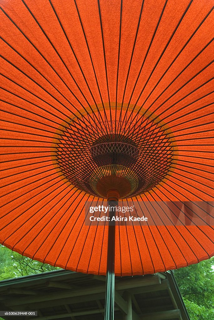 Red Janome umbrella, close-up, low angle view