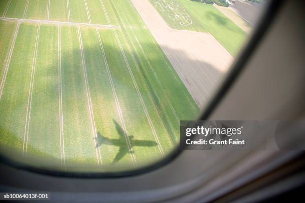 shadow of airplane on field, aerial view from window - plane shadow stock pictures, royalty-free photos & images