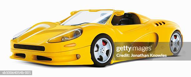 yellow sports car on white background - ferrari fotografías e imágenes de stock