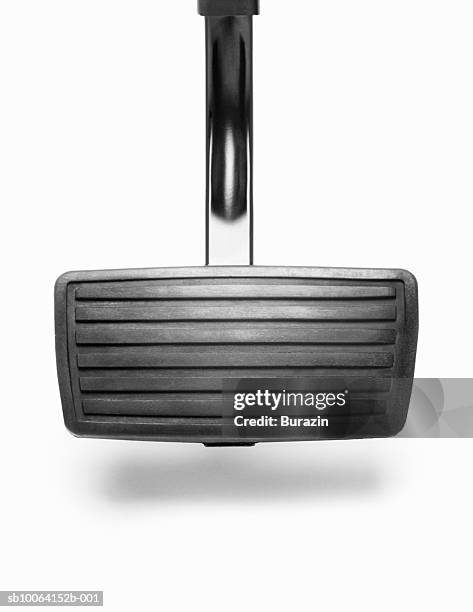 brake pedal on white background, close-up, studio shot - gaspedaal stockfoto's en -beelden