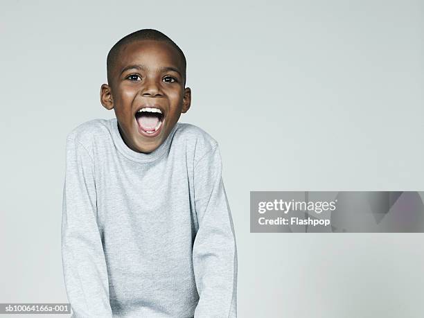 boy (6-7) laughing, close-up - childs pose fotografías e imágenes de stock