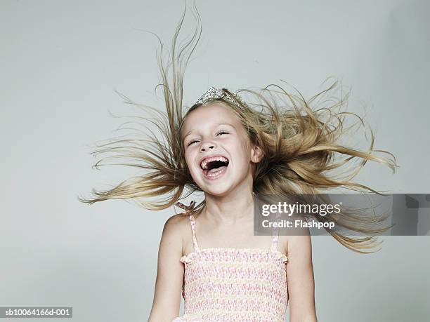 girl (6-7) wearing crown, laughing, close-up - girl close up stock-fotos und bilder