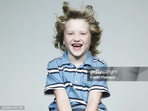 boy (6-7) smiling, portrait, close-up - blond hair wind stock pictures, royalty-free photos & images