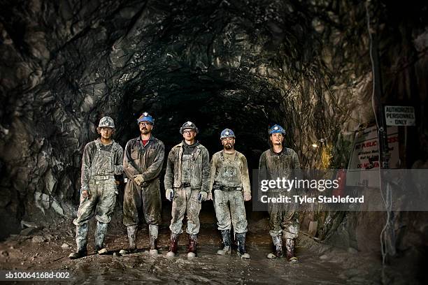 coal miners in front of mine shaft - coal mine stock photos et images de collection