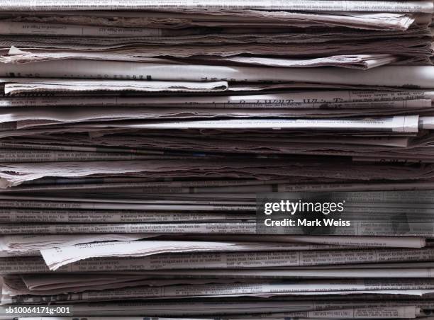 stack of newspapers, close-up - newspaper stack stock-fotos und bilder