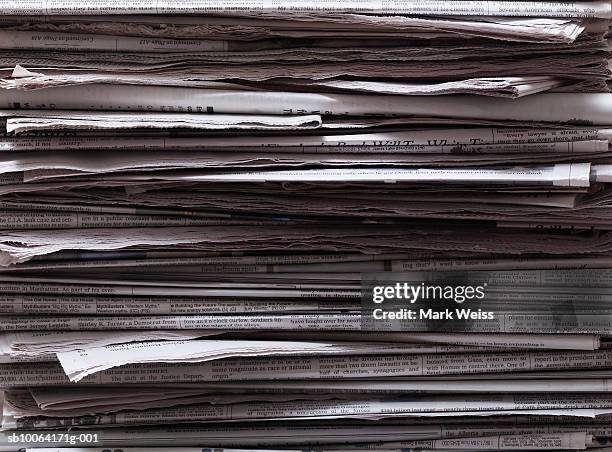 stack of newspapers, close-up - newspaper stockfoto's en -beelden