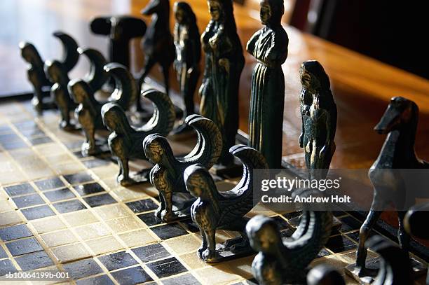 chess pieces with brass minoan, (differential focus) - minoan stock pictures, royalty-free photos & images