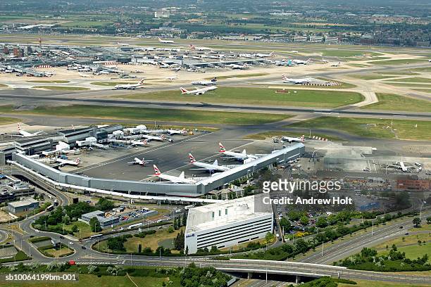 planes waiting at heathrow airport - heathrow airport stock pictures, royalty-free photos & images