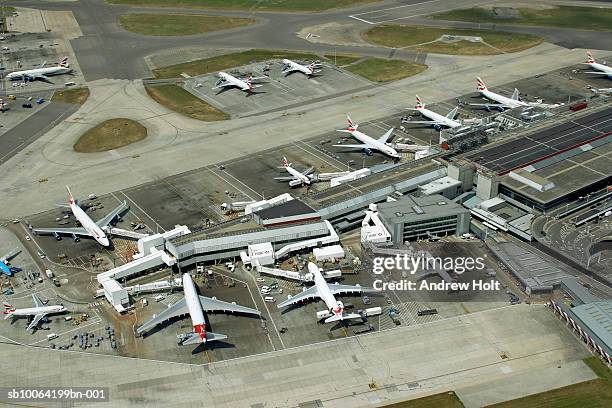 planes waiting at heathrow airport, aerial view - airport aerial stock pictures, royalty-free photos & images