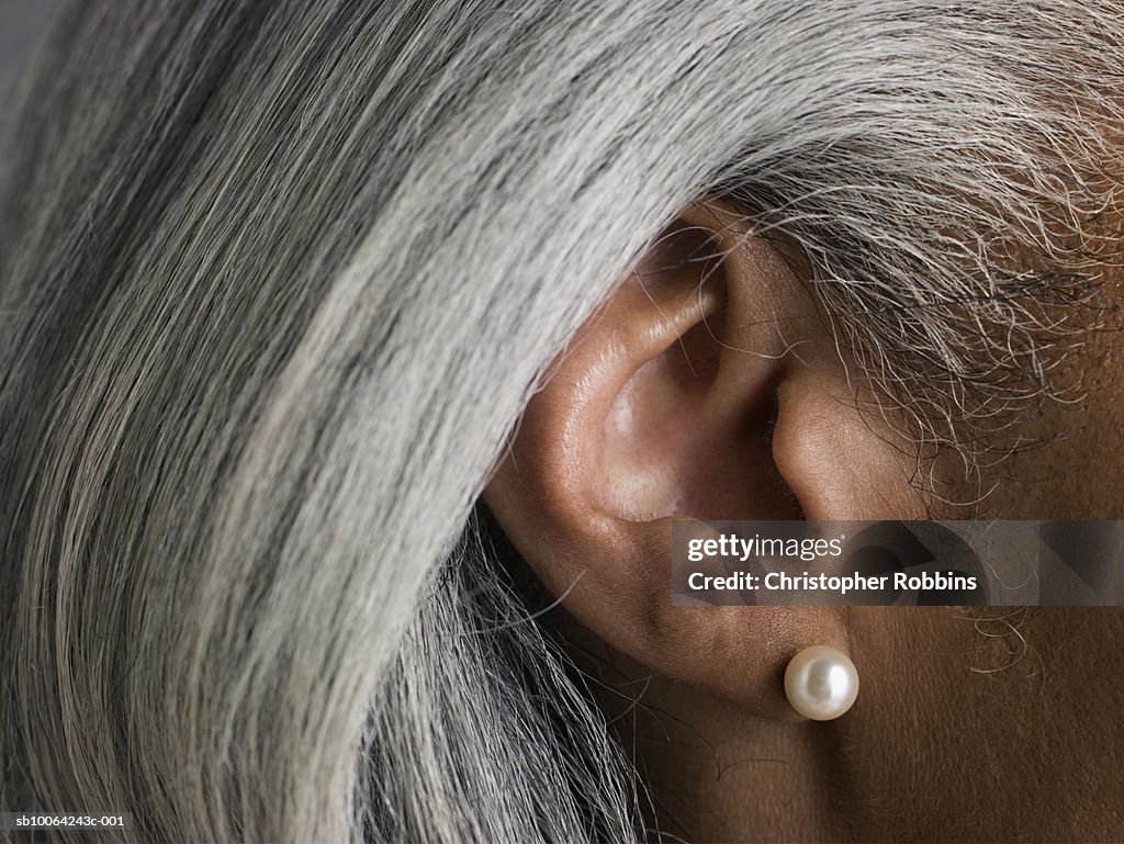 Macro shot of senior woman's ear