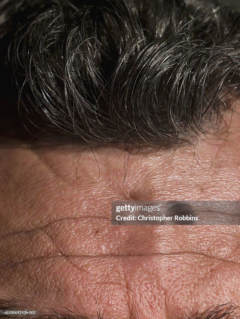 Macro shot of senior man's forehead and hair