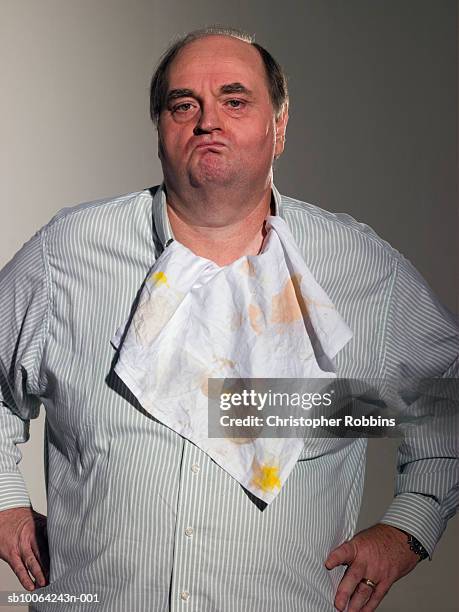 mature man wearing dirty napkin as bib, portrait - ugly fat guy stock pictures, royalty-free photos & images