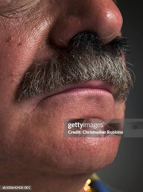 nose hair growing into senior man's moustache, close-up - human nose stockfoto's en -beelden