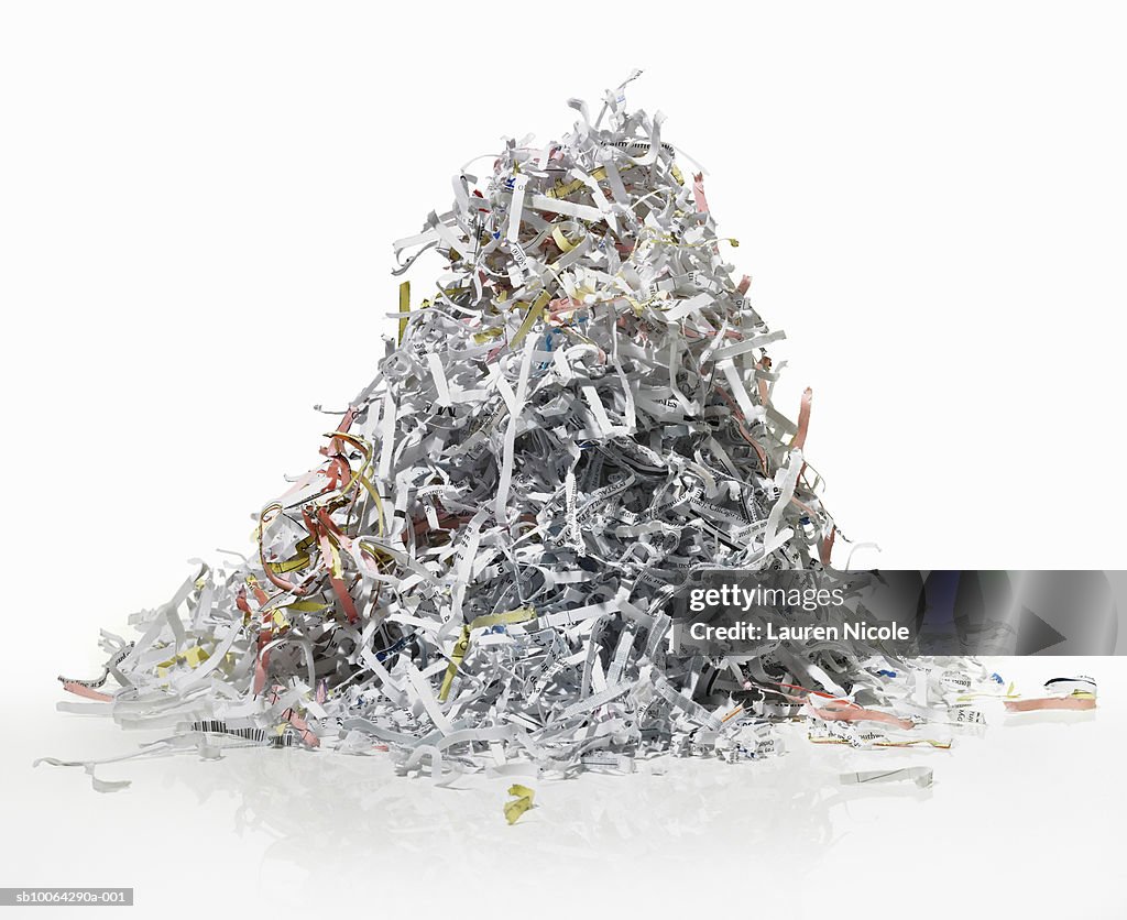 Pile of shredded paper on white background