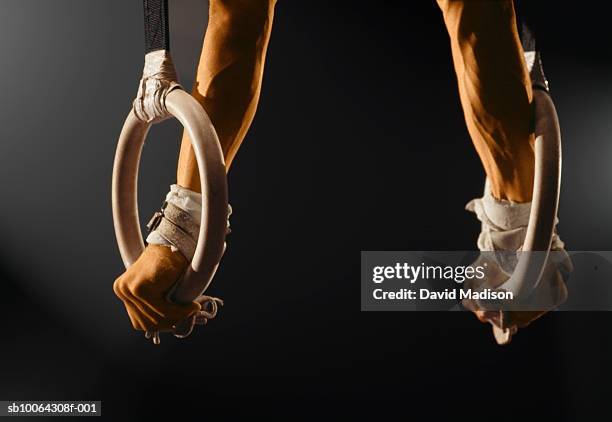 man balancing on gymnastics rings - gymnastic rings equipment bildbanksfoton och bilder
