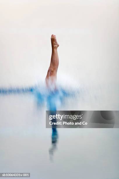 teenage girl (16-17) diving in pool, low section - jump in pool stock pictures, royalty-free photos & images