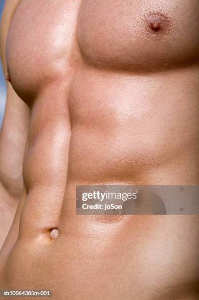 detail of man's stomach, close-up - six pack stock pictures, royalty-free photos & images