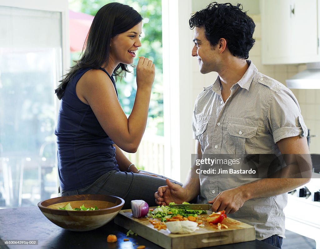 Young couple preparing meal