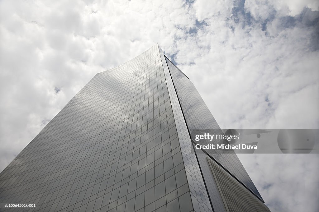 Skyscraper and clouds, low angle view