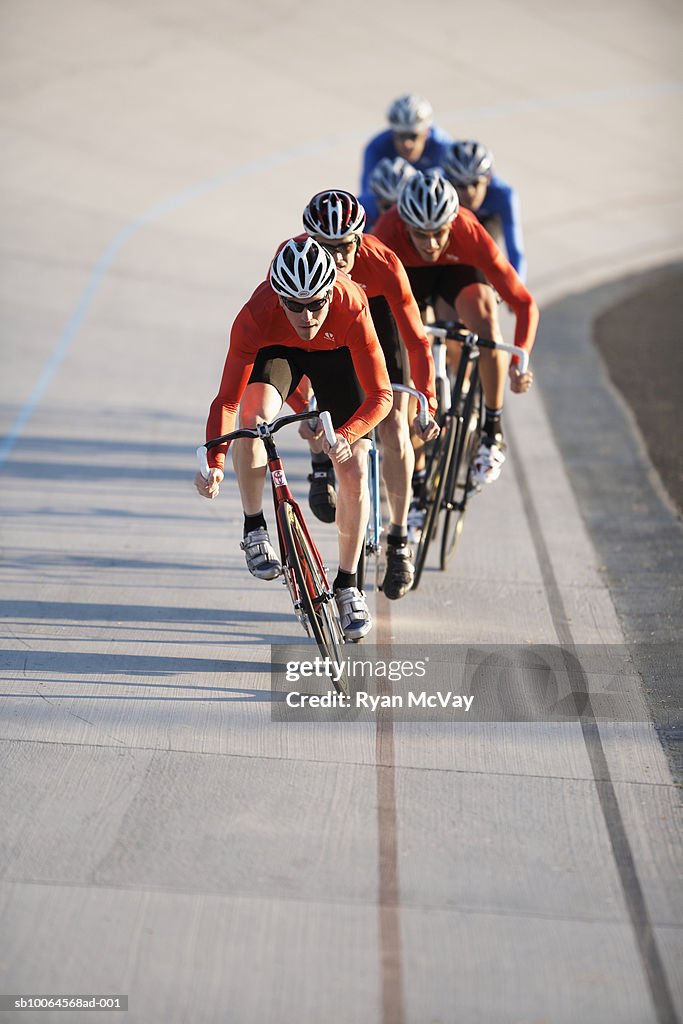 Cyclists in action on velodrome track