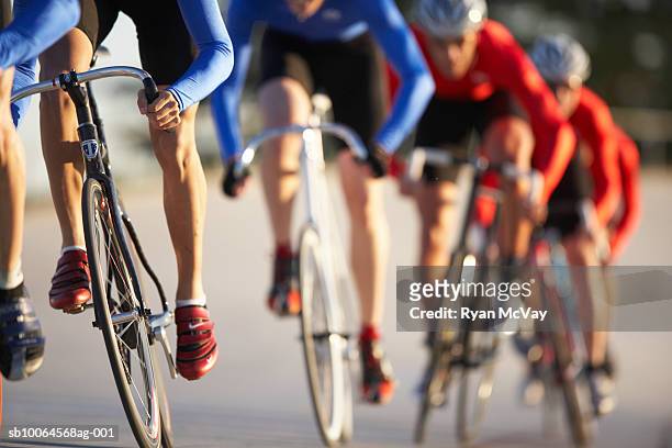 cyclists in action, low section (focus on foreground) - gara sportiva foto e immagini stock