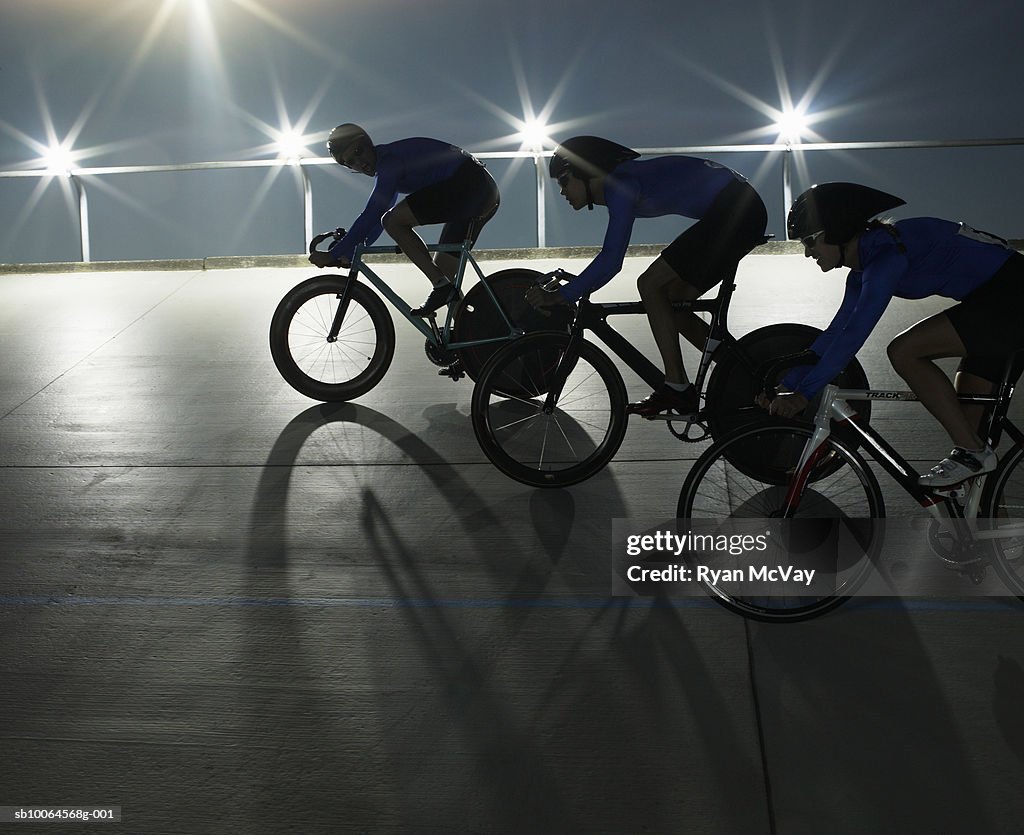 Cyclists in action on velodrome track