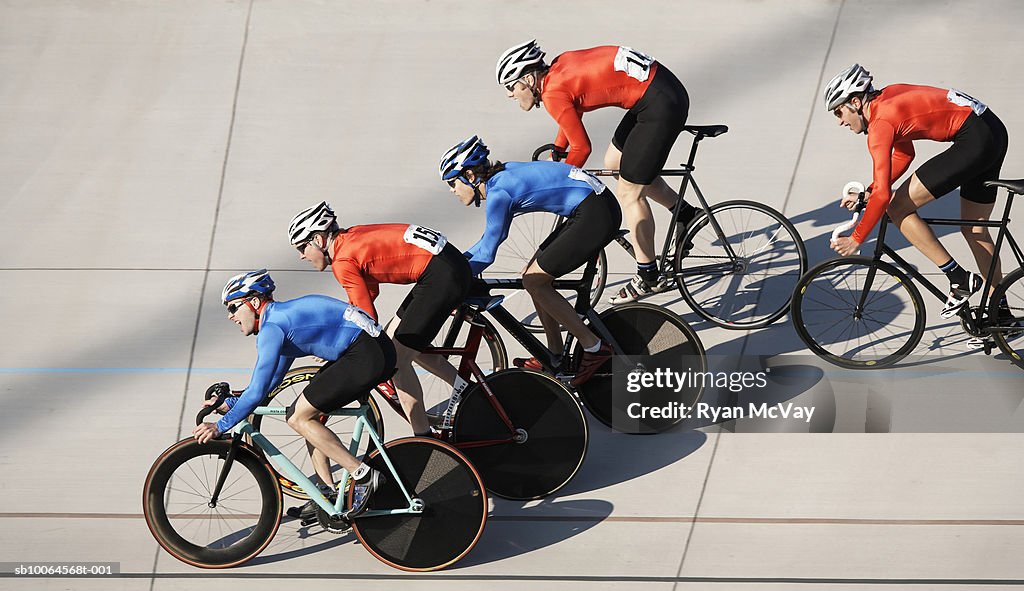 Cyclists in action on velodrome track