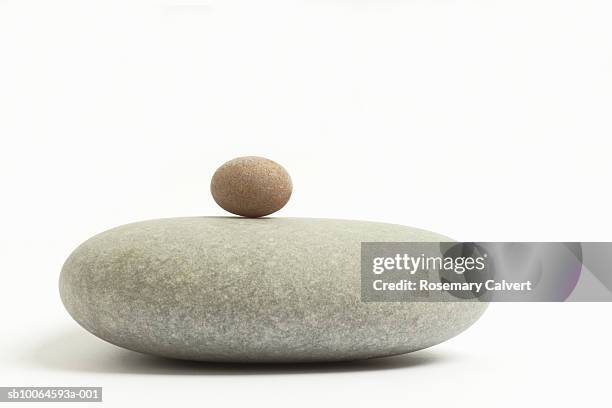 pebbles against white background, close-up - minirock stock pictures, royalty-free photos & images