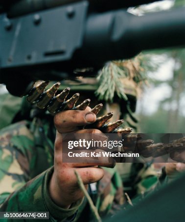 Military Person Loading Machine Gun Closeup High-Res Stock Photo ...