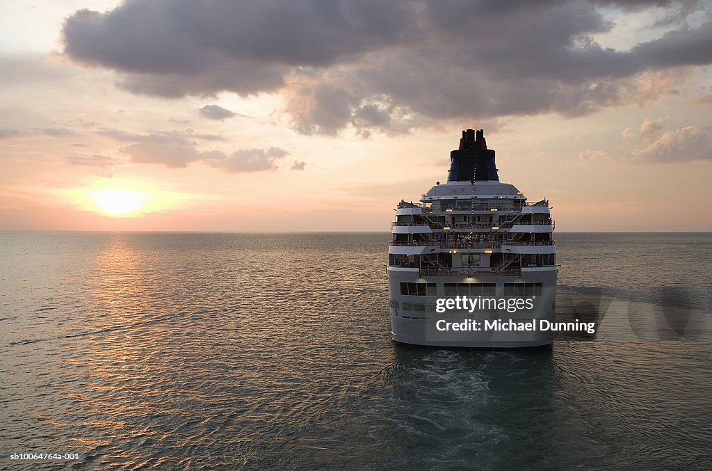 Cruise ship in sea at dusk