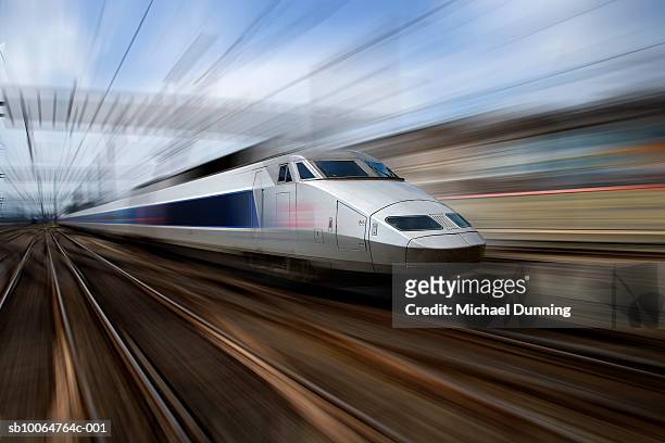 tgv train at speed (blurred motion) - bullet trains stockfoto's en -beelden
