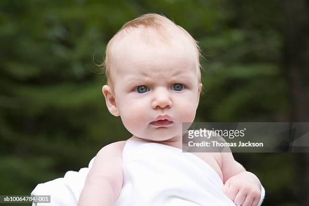 baby girl (2-4 months) frowning outdoors - angry babies stock pictures, royalty-free photos & images