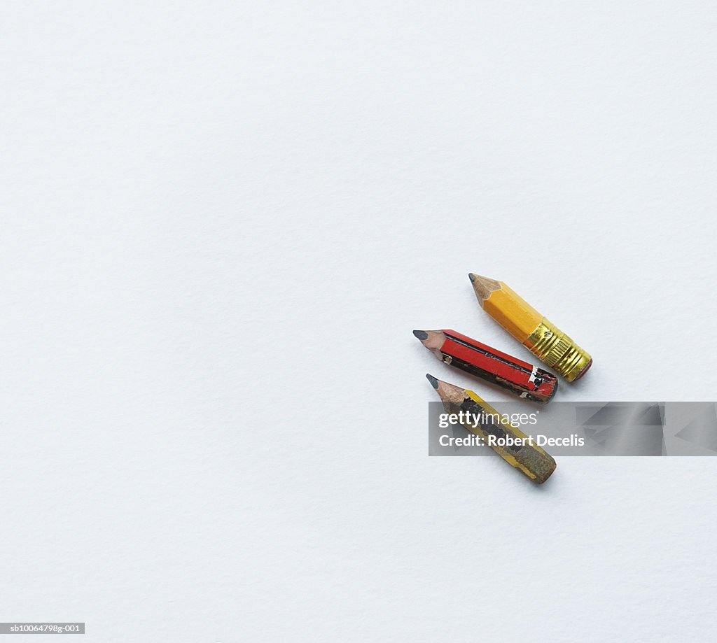 Three small pencils on white background