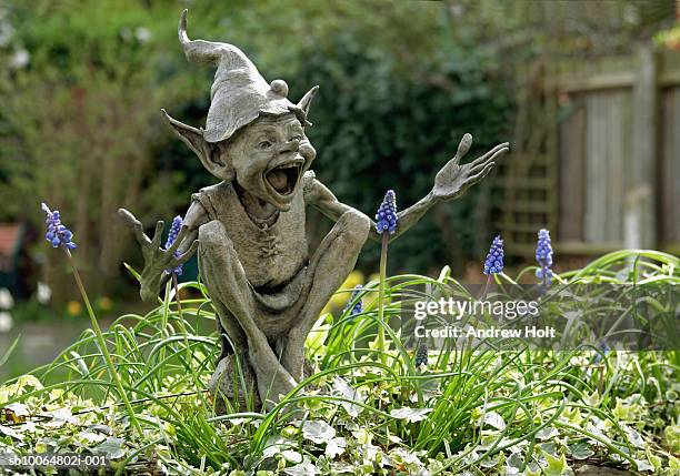 uk, england, isabel's goblin sculpture by david goode in suburban garden - goblin stock pictures, royalty-free photos & images