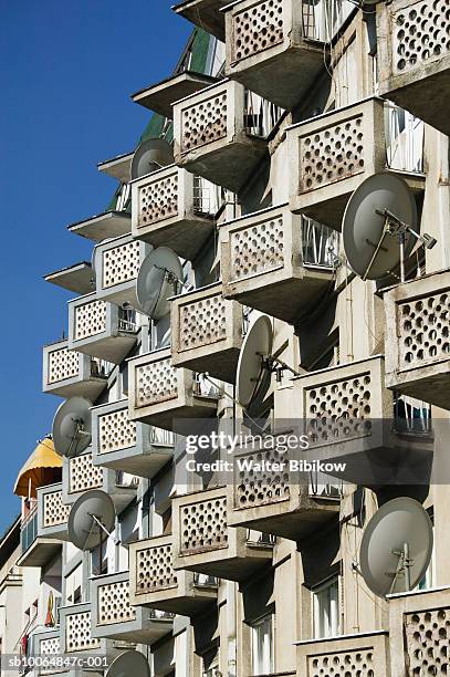kosovo, prishtina, satellite dishes on apartment house - prishtina stock pictures, royalty-free photos & images