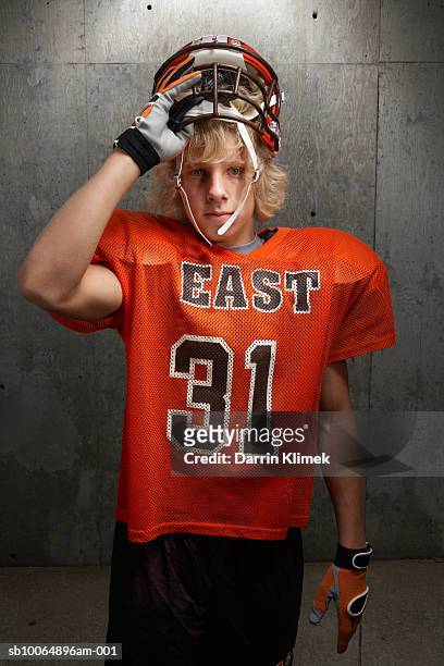portrait of teenage (16-17) american football player - safety american football player imagens e fotografias de stock