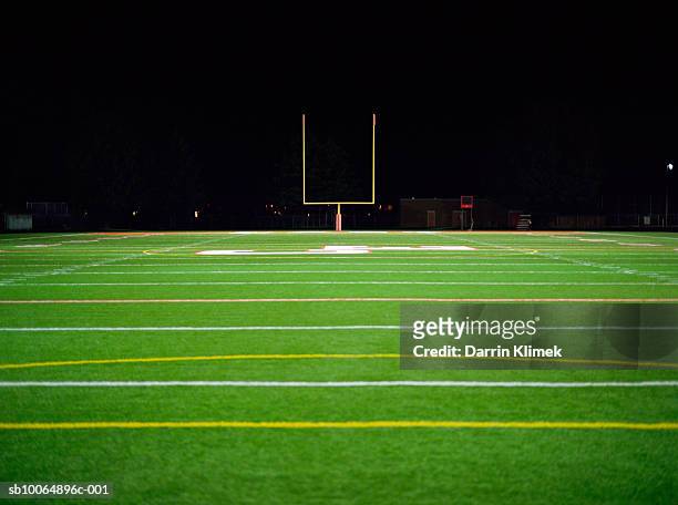 american football field at night - american football field stock pictures, royalty-free photos & images
