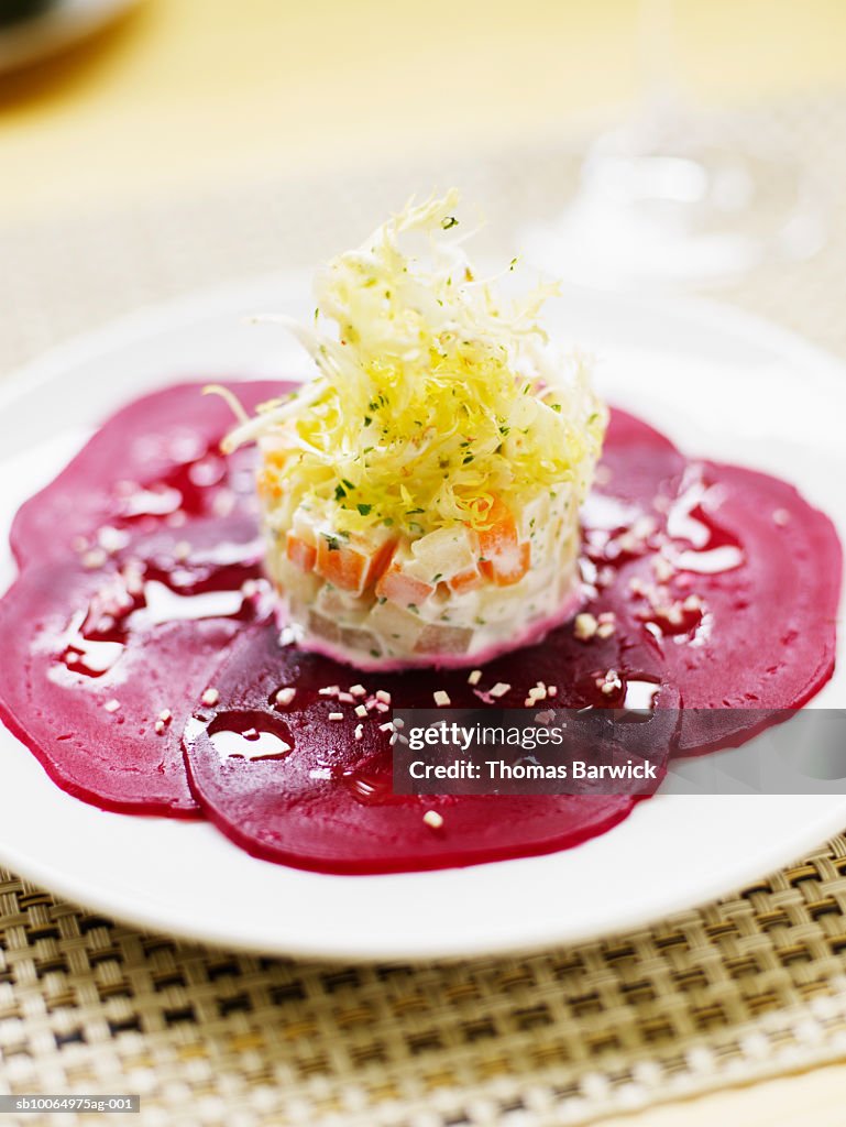 Horseradish vinaigrette on sliced beets, close-up