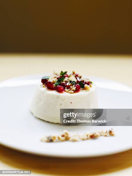 fromage blanc cheesecake with pomegranate seeds, walnuts and lemon thyme, close-up - lemon thyme stock pictures, royalty-free photos & images