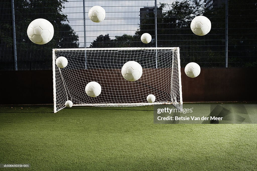 Soccer ball entering soccer net