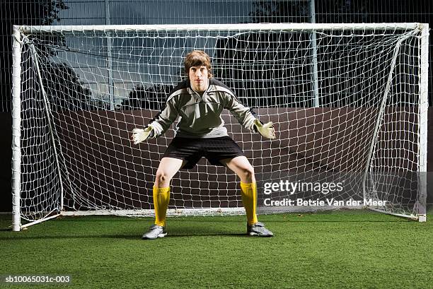 soccer player defending football goal - goalie bildbanksfoton och bilder