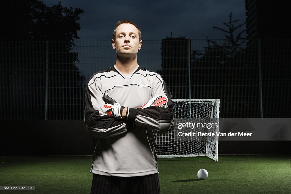 Goalkeeper on football pitch, portrait