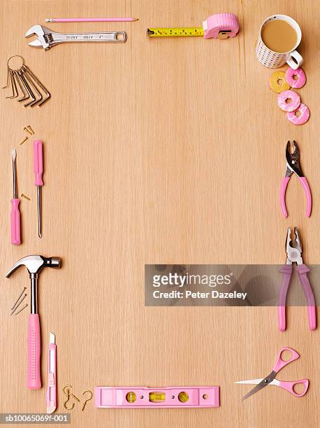 tools with pink handles on table, overhead view - legno rosa foto e immagini stock