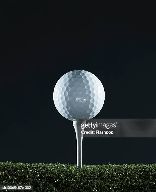 golf ball on tee (surface level) - golf tee stock pictures, royalty-free photos & images
